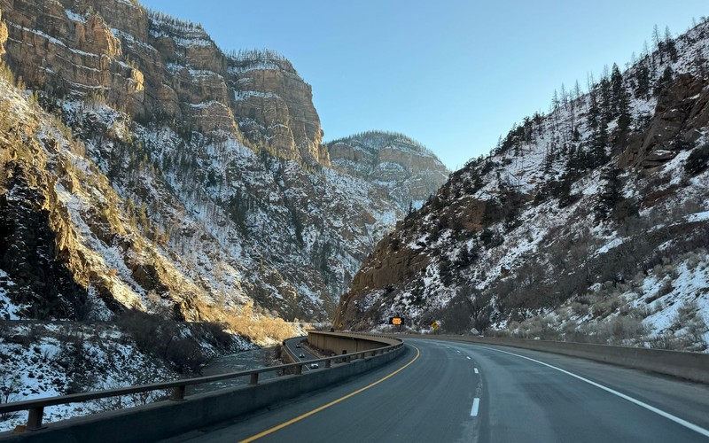 Interstate 70 threading the steep walls of Glenwood Canyon beside the Colorado River